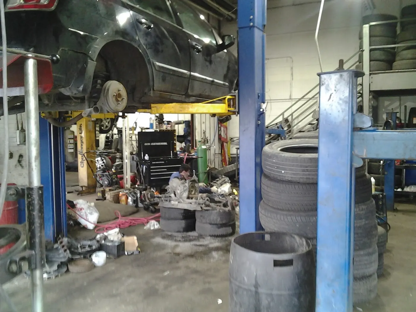 A car on the lift in the service bay